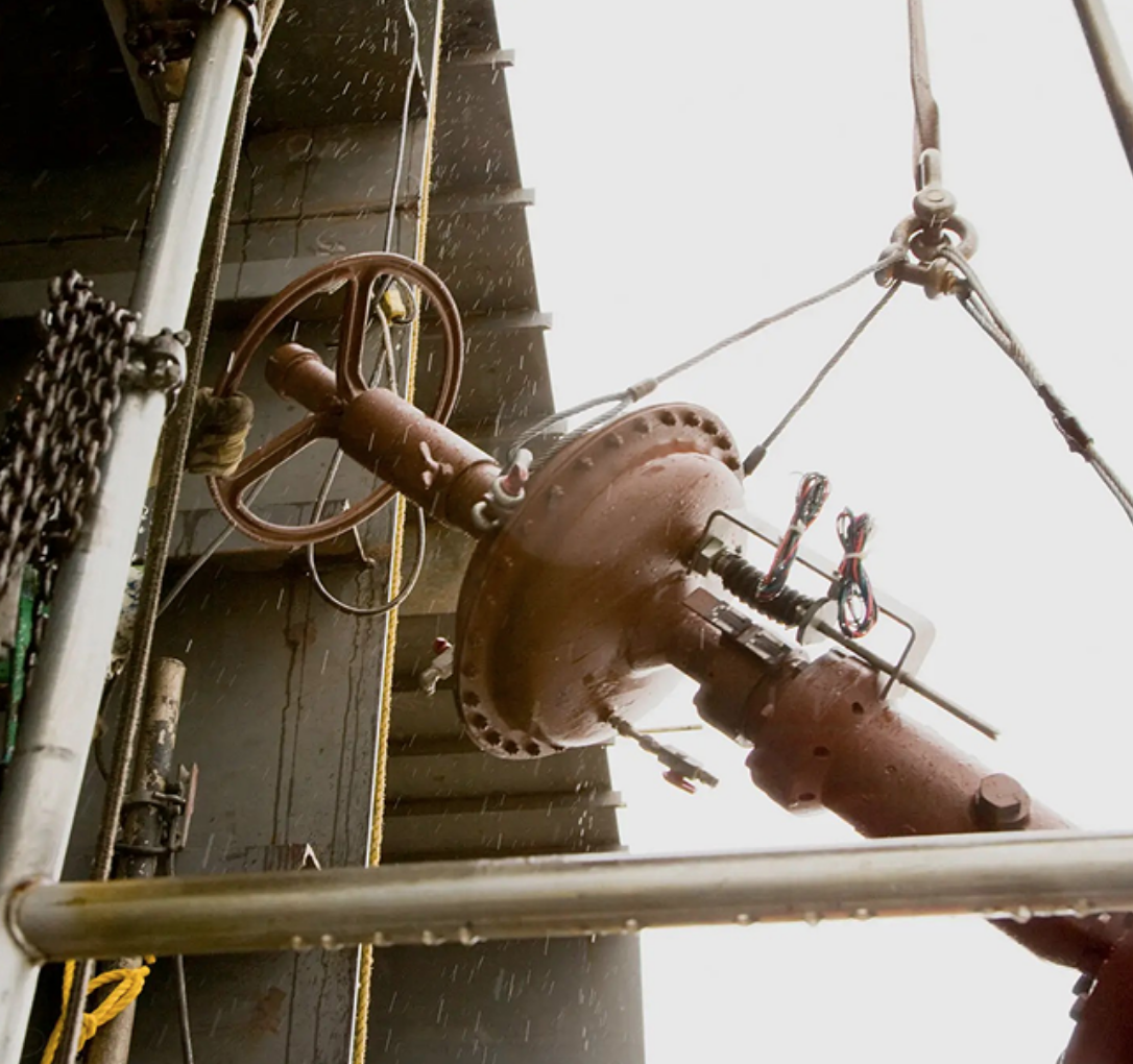 Crew relocating an industrial production line machine in an Arizona facility